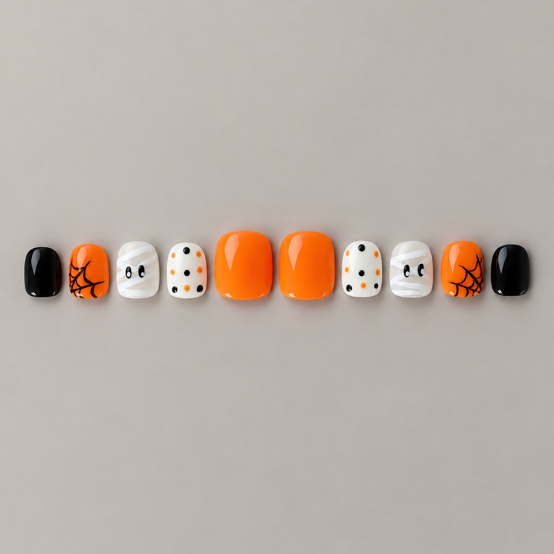 Wrap & Web U.P.O.N Mini Halloween press-on nails in orange, black, mummy, dots and spiderweb designs